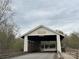 Charming covered bridge with Millbridge signage and scenic surroundings at 3034 Oakmere Rd, Waxhaw, NC 28173