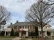 Elegant clubhouse exterior with brick facade and well-manicured landscaping at 3034 Oakmere Rd, Waxhaw, NC 28173
