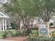 Inviting common area with lush greenery, benches, and stone signage at 3034 Oakmere Rd, Waxhaw, NC 28173