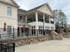 Impressive community clubhouse with a large porch and stone accents at 3034 Oakmere Rd, Waxhaw, NC 28173