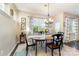 Cozy dining room featuring an elegant light fixture and natural light creating a warm ambiance at 3034 Oakmere Rd, Waxhaw, NC 28173