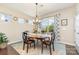 Charming dining area with elegant decor and a large window that brightens the space at 3034 Oakmere Rd, Waxhaw, NC 28173