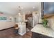 Open kitchen with granite countertops, stainless steel appliances, and dark wood cabinets at 3034 Oakmere Rd, Waxhaw, NC 28173
