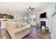 Open-concept living room with fireplace, and kitchen area that enhances the home's interior flow at 3034 Oakmere Rd, Waxhaw, NC 28173
