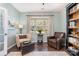 Bright living room featuring stylish chairs, a window that provides natural light, and elegant decor at 3034 Oakmere Rd, Waxhaw, NC 28173
