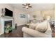 Comfortable living room with fireplace, neutral tones, and natural light that creates a cozy ambiance at 3034 Oakmere Rd, Waxhaw, NC 28173