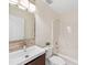 Modern bathroom with a sleek vanity, stylish mirror, and a shower-tub combination at 3222 Shadow Lake Ln, Matthews, NC 28104