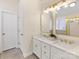 Bright bathroom features double sinks, white cabinets, quartz countertops, and sleek gold fixtures at 3222 Shadow Lake Ln, Matthews, NC 28104