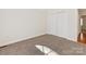 Neutral carpet bedroom with bi-fold closet doors at 3222 Shadow Lake Ln, Matthews, NC 28104