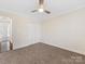 Cozy bedroom featuring neutral walls, plush carpeting, and ample closet space at 3222 Shadow Lake Ln, Matthews, NC 28104