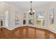 Breakfast nook with large windows offering backyard views and lots of natural light at 3222 Shadow Lake Ln, Matthews, NC 28104