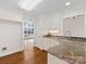 Kitchen with granite counters and a sink overlooking the yard at 3222 Shadow Lake Ln, Matthews, NC 28104