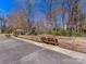 Community playground with swings, slide, and shaded picnic area, creating a fun and engaging outdoor space at 3222 Shadow Lake Ln, Matthews, NC 28104