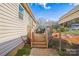 Enjoy this cozy outdoor deck space with stairs leading to the landscaped backyard at 340 W Memorial Hwy, Harmony, NC 28634