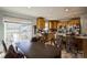 Bright kitchen with wooden cabinets, stainless steel appliances, and a sliding glass door to the deck at 340 W Memorial Hwy, Harmony, NC 28634