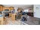 Open-concept kitchen with wood cabinets, a breakfast bar, and a view into the living area at 340 W Memorial Hwy, Harmony, NC 28634