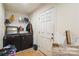 This laundry room features a modern washer and dryer, wire shelving, and neutral decor at 340 W Memorial Hwy, Harmony, NC 28634