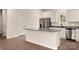 Bright, modern kitchen with stainless steel appliances and a large center island at 3523 Narrow Ln, Charlotte, NC 28215