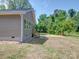 Side view of home and backyard showing the home's exterior, and spacious lot at 406 White Store Rd, Wadesboro, NC 28170