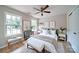 Stylishly decorated bedroom with wood-look floors, complemented by soft furnishings and bright natural light at 406 White Store Rd, Wadesboro, NC 28170