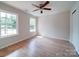 Bright bedroom with wood-look flooring and natural light from the double window at 406 White Store Rd, Wadesboro, NC 28170