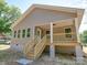 Side view of newly built home featuring a covered porch with wooden stairs at 406 White Store Rd, Wadesboro, NC 28170