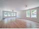 Spacious living room with beautiful floors and plenty of natural light from large windows at 406 White Store Rd, Wadesboro, NC 28170