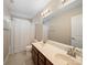 Bathroom with a large mirror above the double sink vanity and a shower/tub combination at 4127 Stacy Blvd, Charlotte, NC 28209