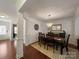 Elegant dining room with hardwood floors, chandelier, and adjacent living space at 4127 Stacy Blvd, Charlotte, NC 28209