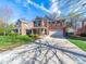 Charming two-story brick home with well-manicured lawn, inviting curb appeal, and two-car garage at 4127 Stacy Blvd, Charlotte, NC 28209