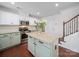 Kitchen island with granite countertops, stainless steel appliances, and wooden floors at 4127 Stacy Blvd, Charlotte, NC 28209