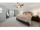 Bright and spacious main bedroom with neutral tones, a ceiling fan, and great natural light at 4127 Stacy Blvd, Charlotte, NC 28209