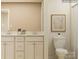 Well-lit bathroom featuring double vanity, a toilet, framed artwork, and neutral color palette at 4155 Skyboat Cir, Fort Mill, SC 29715