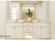 Bright bathroom featuring double vanity, white cabinets, and a glass-enclosed shower with decorative tile at 4155 Skyboat Cir, Fort Mill, SC 29715