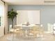 Neutral dining room featuring a round table, light wood chairs, and a decorative plant at 4155 Skyboat Cir, Fort Mill, SC 29715