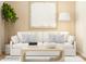 Bright living room features a comfortable white couch and minimalist decor for a modern feel at 4155 Skyboat Cir, Fort Mill, SC 29715