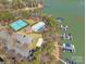 Overhead view of community amenities including tennis courts, in-ground pool, and boat slips on the lake at 4536 Rustling Woods Dr, Denver, NC 28037