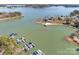 Scenic aerial shot of boat slips on a tranquil lake with waterfront homes and lush green surroundings at 4536 Rustling Woods Dr, Denver, NC 28037