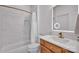 This bathroom features a vanity with modern lighting, tub/shower combo, and a toilet at 4536 Rustling Woods Dr, Denver, NC 28037