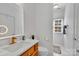 The bathroom offers vanity with modern lighting, faucet, toilet, and a white wall color at 4536 Rustling Woods Dr, Denver, NC 28037
