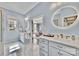 Bright bathroom featuring double vanity sinks, a marble floor, and a glass-enclosed shower at 4536 Rustling Woods Dr, Denver, NC 28037