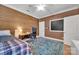 Bedroom features wood paneled wall, chalkboard, and hardwood floors at 4536 Rustling Woods Dr, Denver, NC 28037