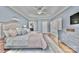 Spacious bedroom features trey ceiling, light blue walls, and hardwood floors at 4536 Rustling Woods Dr, Denver, NC 28037