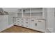 This closet space features cabinets, drawers, shelving, and plenty of room for clothes at 4536 Rustling Woods Dr, Denver, NC 28037