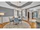 Elegant dining room with wainscoting, a chandelier, and hardwood floors at 4536 Rustling Woods Dr, Denver, NC 28037