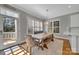 Dining room featuring bench seating, decorative lighting, and natural light at 4536 Rustling Woods Dr, Denver, NC 28037
