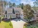 Charming traditional-style home with an inviting entryway, three-car garage and a well-manicured front yard at 4536 Rustling Woods Dr, Denver, NC 28037
