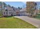 Charming traditional-style home with an inviting entryway, three-car garage and a well-manicured front yard at 4536 Rustling Woods Dr, Denver, NC 28037