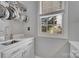Butler's pantry features bright window and white cabinets and countertop with sink at 4536 Rustling Woods Dr, Denver, NC 28037