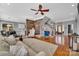 Spacious living area featuring wood accents, hardwood floors, and a staircase to the second floor at 4536 Rustling Woods Dr, Denver, NC 28037